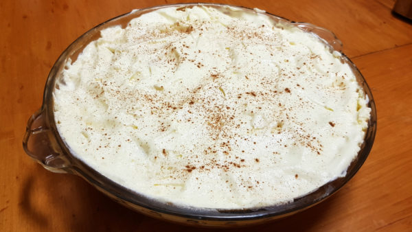 Banoffee Pie in it's final form with a dusting of cinnamon on top.