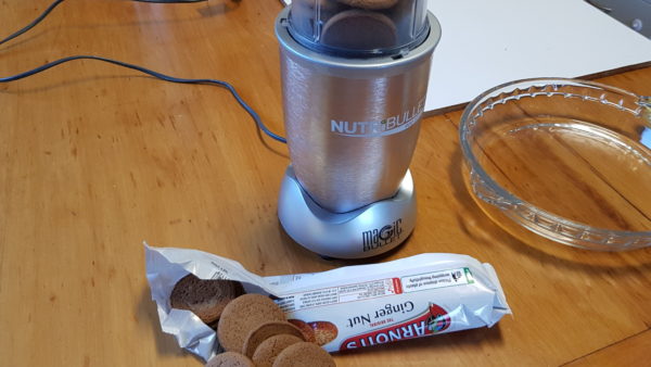 Food processing the gingernut biscuits for banoffee pie base.